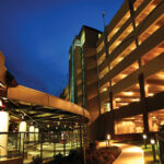 Figure 2: In previous editions of the code, open parking garages like this one did not require automatic fire sprinkler protection. New code editions have eliminated sprinkler exceptions for open parking garages. Courtesy: CDM Smith