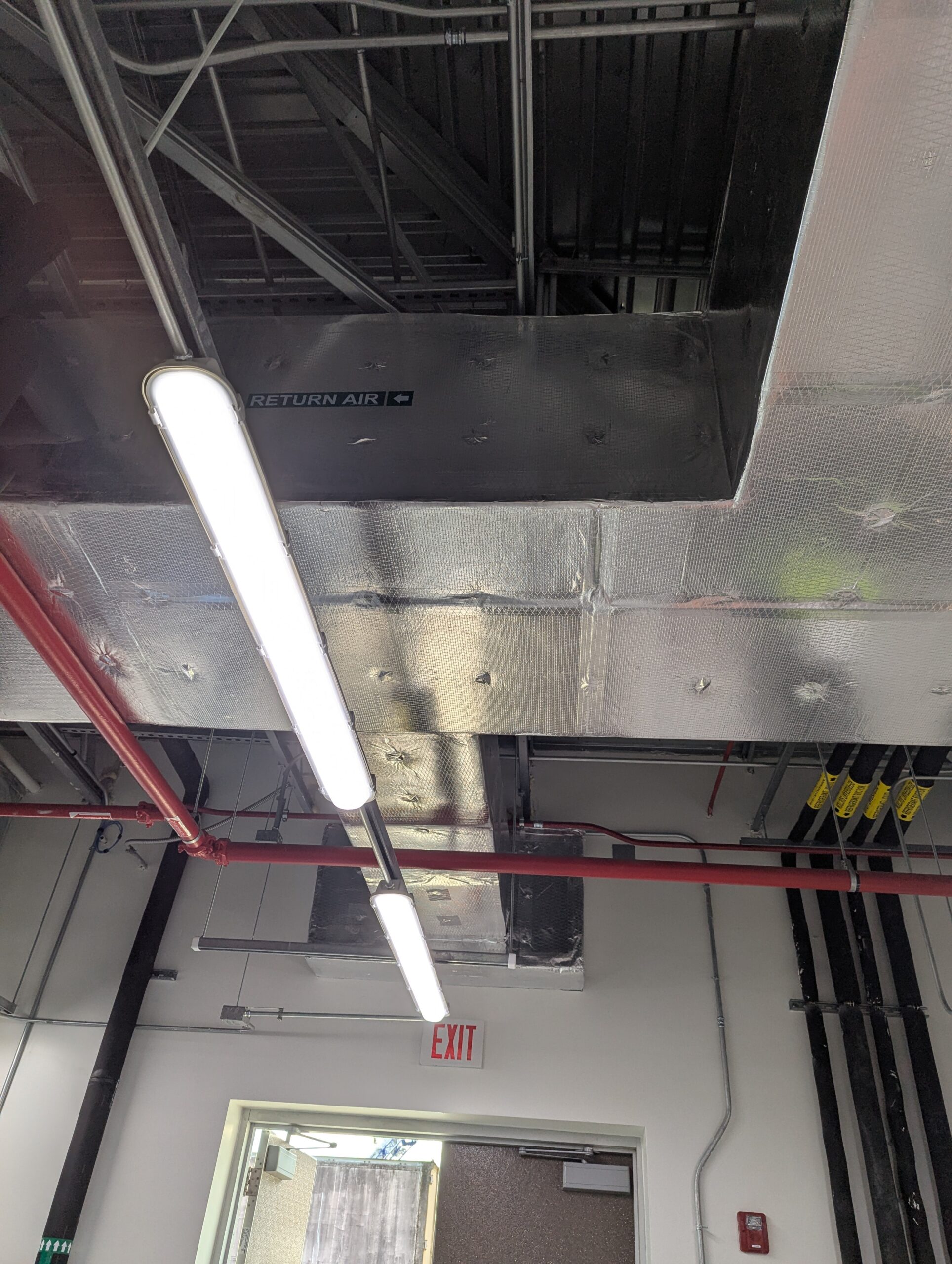 Figure 2: Indoor unit return ductwork with outside air connection via ducted louver. Courtesy: CDM Smith
