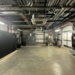 Figure 4. The main electrical room from a lab expansion with uninterruptable power supply, main switchboard and optional loads automatic transfer switch. Courtesy: CDM Smith