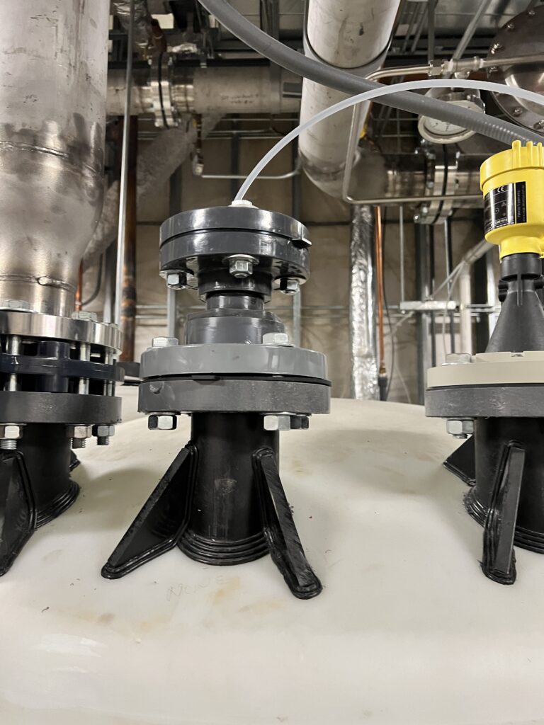 Figure 1: Instrumentation connections installed on a chemical storage tank illustrate the importance of mechanical and process coordination and material compatibility in process control environments. Ensuring proper sensor placement and chemical resistance is critical for effective system integration and long-term reliability. Courtesy: Page