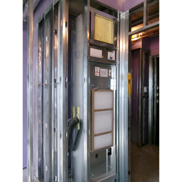 Figure 2: A water-source vertical stack heat pump installation at a multifamily apartment building in Brooklyn, N.Y. that will provide heating and cooling for an apartment unit. Courtesy: CDM Smith