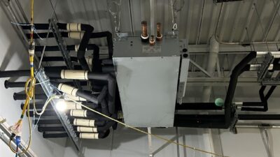 Figure 2: A heat recovery variable refrigerant flow branch controller in a mechanical room. Courtesy: CDM Smith
