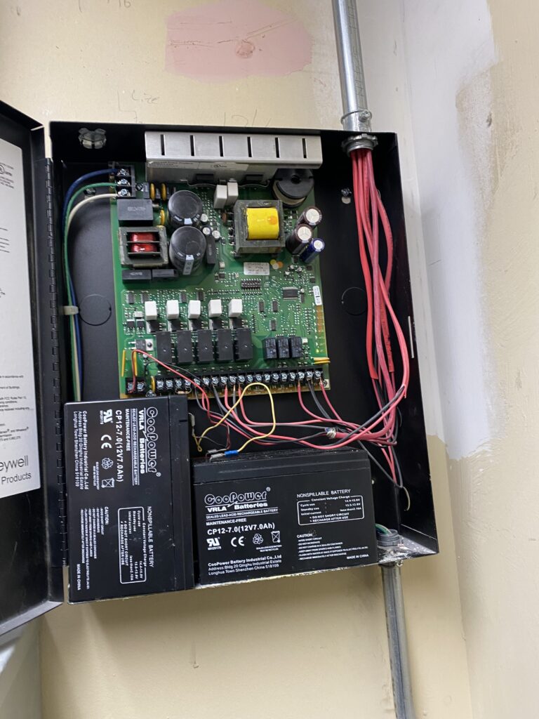 Interior of a notification appliance circuit booster panel. Strobe sync signals are typically proprietary to each manufacturer and require careful coordination to ensure that strobes are compatible with power supplies. Courtesy: McGuire Engineers Inc.