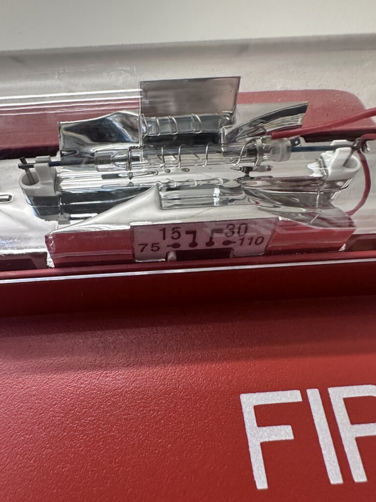 Close up of a xenon tube in a conventional fire alarm strobe. Xenon strobe can use draw significantly more current than a comparable LED strobe. Courtesy: McGuire Engineers Inc.