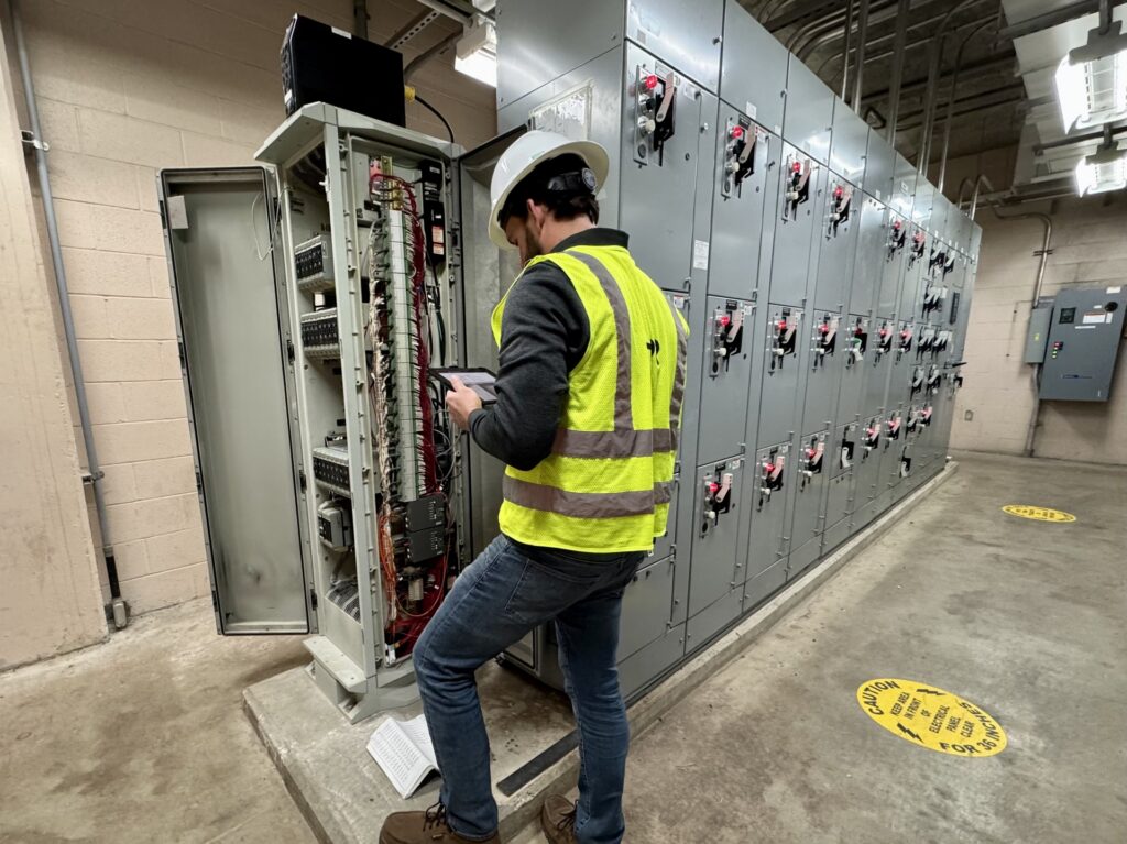 Figure 5: Photos of control systems engineers performing a field investigation to develop a replacement approach for controller locations in a working facility. Courtesy: HDR