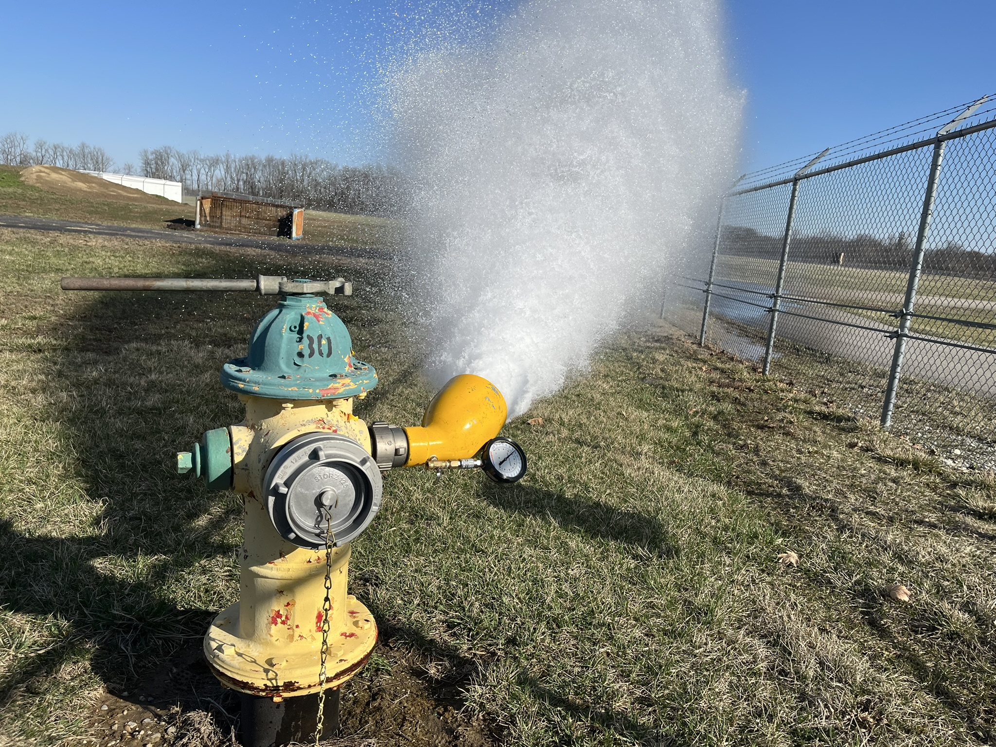 Fire hydrant flow testing provides valuable input data for the development of water infrastructure, assisting in community planning. In this setup, the diffuser is attached to a hydrant outlet and directs discharged water away from the hydrant. The diffuser enables high-volume flow to be released safely even in constrained or landscaped areas. Courtesy: CDM Smith