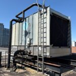 Figure 1: Existing open cooling tower located on building roof. Courtesy: HDR