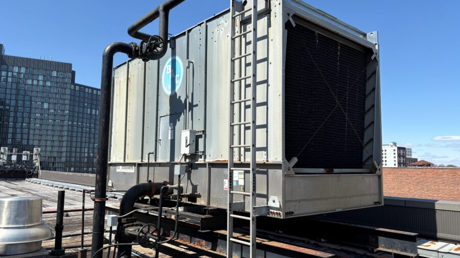 Figure 1: Existing open cooling tower located on building roof. Courtesy: HDR