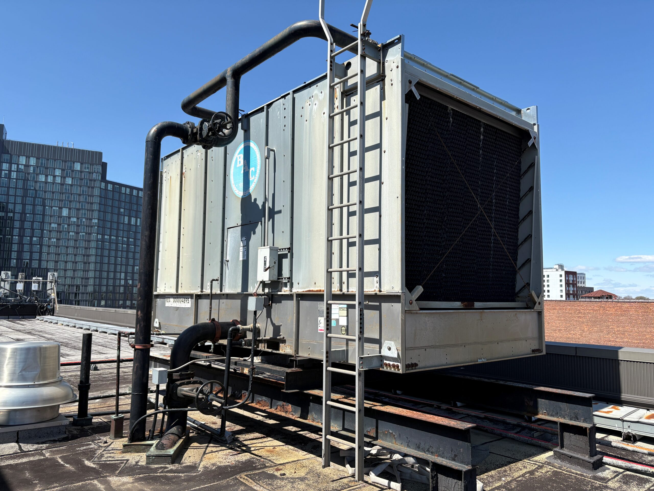 Figure 1: Existing open cooling tower located on building roof. Courtesy: HDR