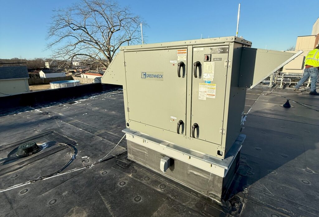 Figure 3: An energy recovery ventilator unit installed at an administration building in Massachusetts. The ventilator exchanges heat between outdoor air and ventilation from occupied spaces. It operates in air economizer mode when the outdoor air temperature is below 60°F and modulates the outside air damper and return air damper to maintain the mixed air temperature set point. Courtesy: CDM Smith