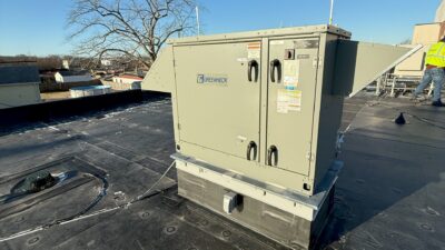 Figure 3: An energy recovery ventilator unit installed at an administration building in Massachusetts. The ventilator exchanges heat between outdoor air and ventilation from occupied spaces. It operates in air economizer mode when the outdoor air temperature is below 60°F and modulates the outside air damper and return air damper to maintain the mixed air temperature set point. Courtesy: CDM Smith