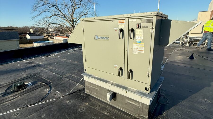 Figure 3: An energy recovery ventilator unit installed at an administration building in Massachusetts. The ventilator exchanges heat between outdoor air and ventilation from occupied spaces. It operates in air economizer mode when the outdoor air temperature is below 60°F and modulates the outside air damper and return air damper to maintain the mixed air temperature set point. Courtesy: CDM Smith