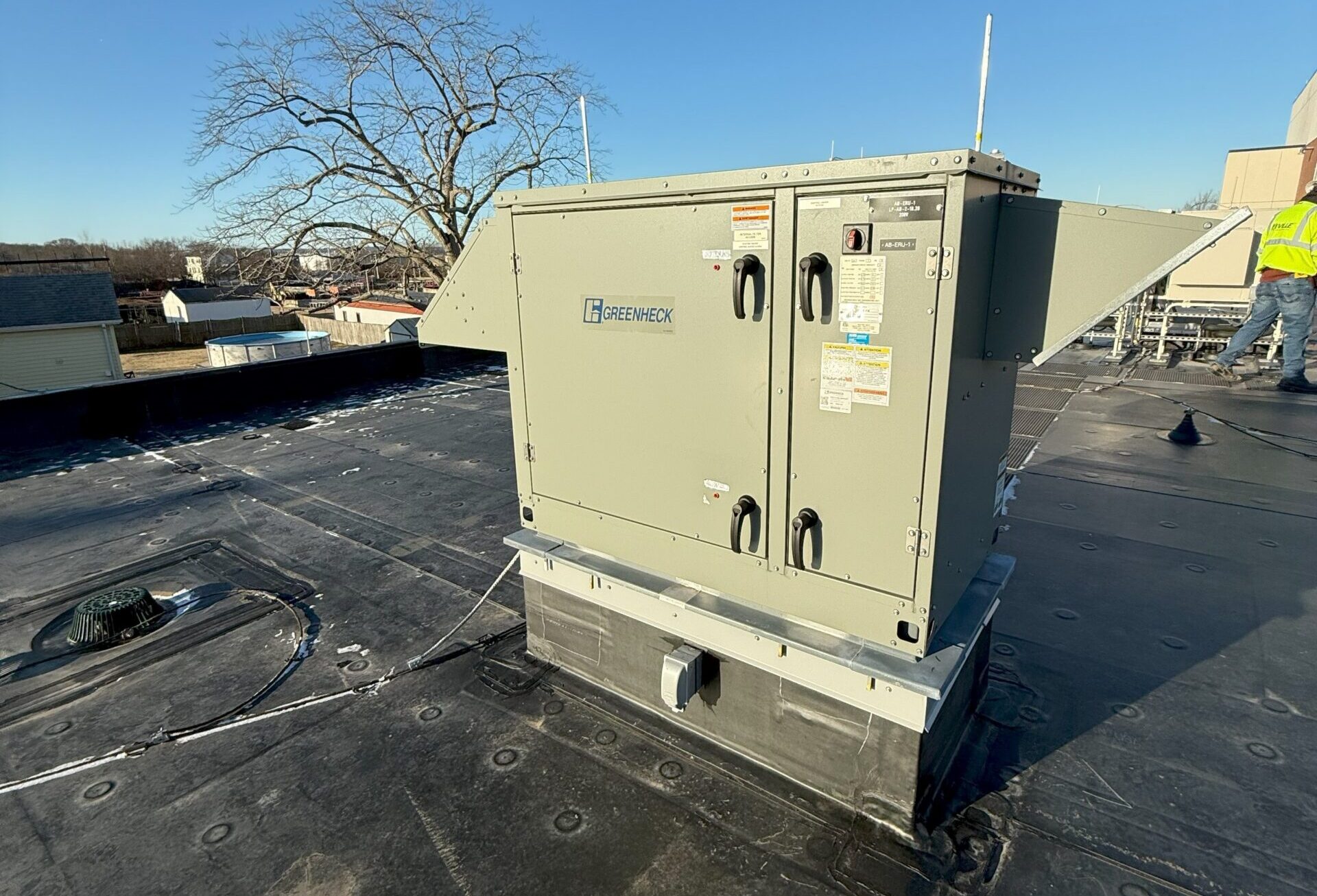 Figure 3: An energy recovery ventilator unit installed at an administration building in Massachusetts. The ventilator exchanges heat between outdoor air and ventilation from occupied spaces. It operates in air economizer mode when the outdoor air temperature is below 60°F and modulates the outside air damper and return air damper to maintain the mixed air temperature set point. Courtesy: CDM Smith