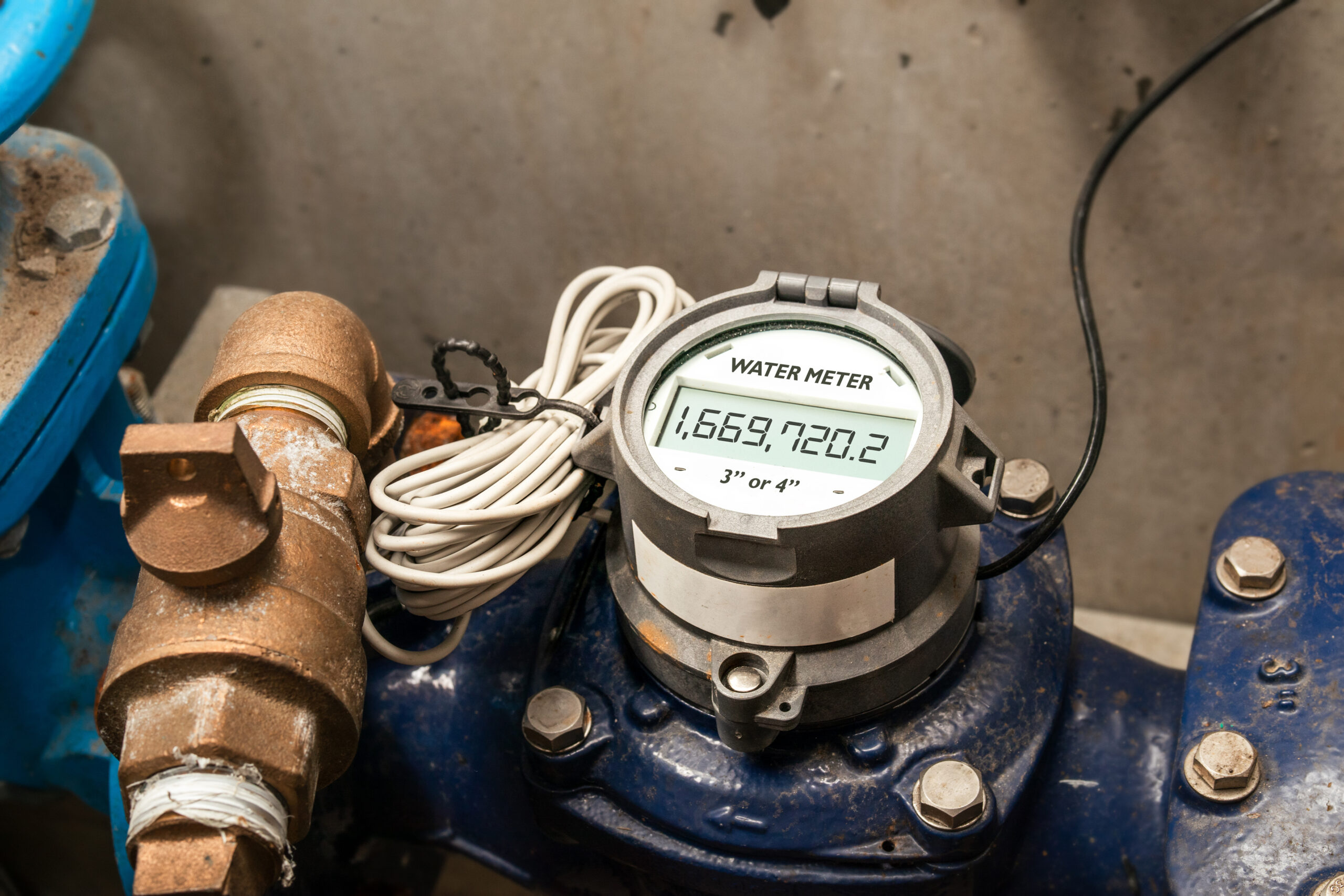 Water meter in building with commercial and residential units. Digital measuring device for water usage of property and accuracy in billing of water consumption.