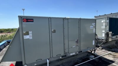Figure 1: Unitary packaged rooftop unit with an outdoor air intake hood. Courtesy: CDM Smith