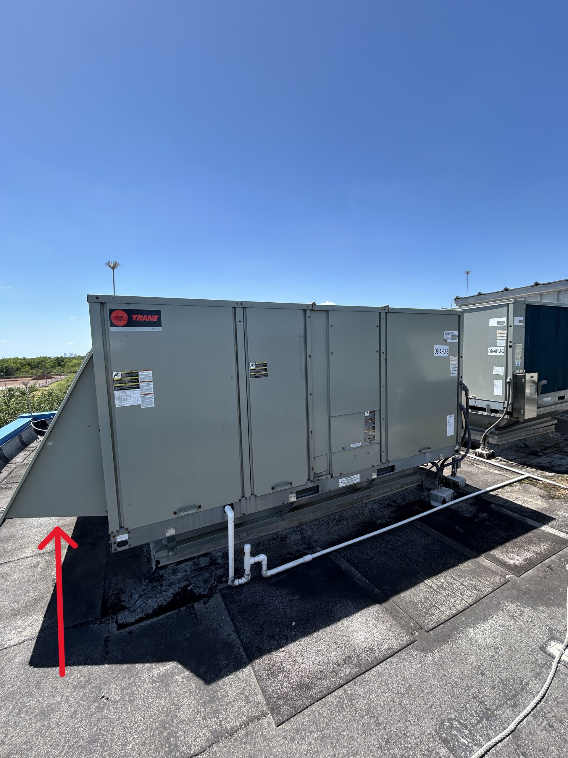 Figure 1: Unitary packaged rooftop unit with an outdoor air intake hood. Courtesy: CDM Smith