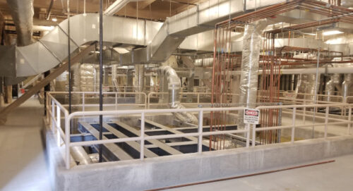 Interstitial space above operating rooms with signage on one side of the opening. Courtesy: IMEG Corp.