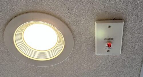 Figure 2: Test button and LED indicator provided for the adjacent general-purpose downlight fixture with battery backup. Courtesy: SHP